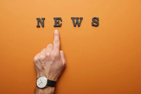 Cropped View Man Pointing Finger News Lettering Orange — Stock Photo, Image