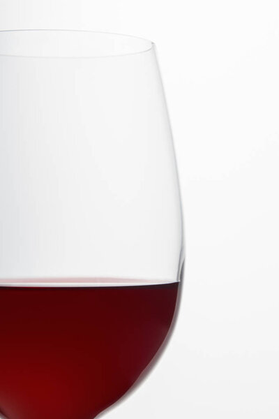 Glass of burgundy red wine isolated on white