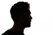 Silhouette of pensive man looking away isolated on white
