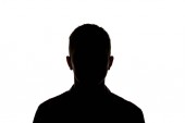 Silhouette of man looking at camera isolated on white