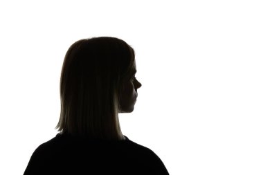 Silhouette of woman looking away isolated on white clipart