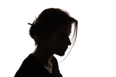 Silhouette of pensive woman looking down isolated on white clipart