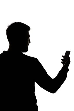 Silhouette of man holding smartphone with blank screen isolated on white clipart