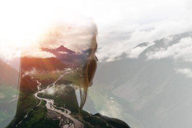 Double exposure of girl and mountains in clouds clipart