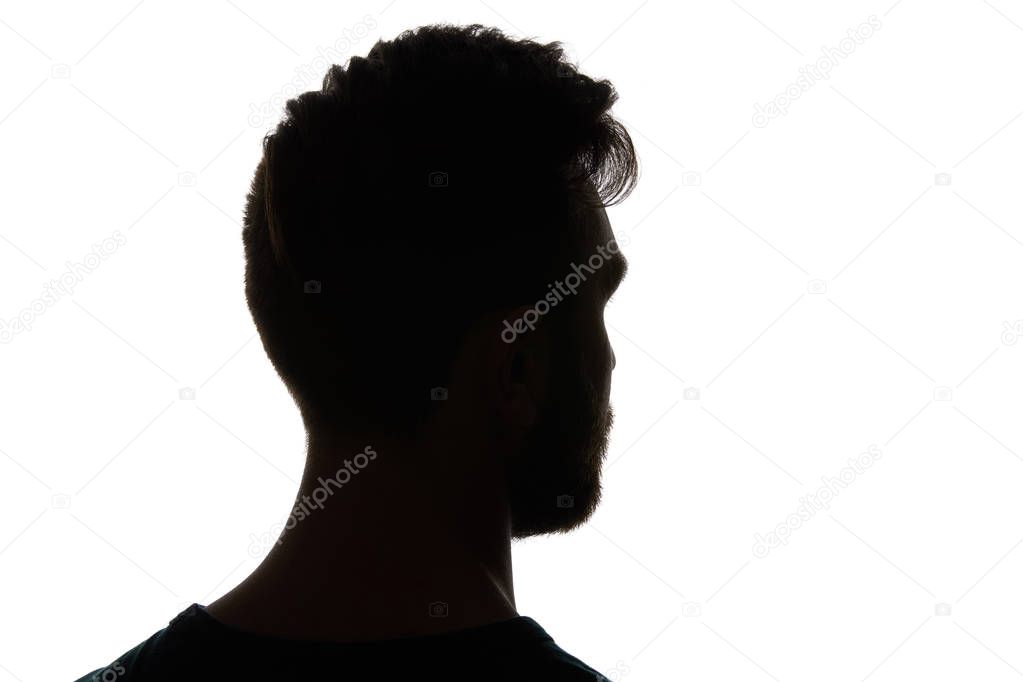 Silhouette of man looking away isolated on white