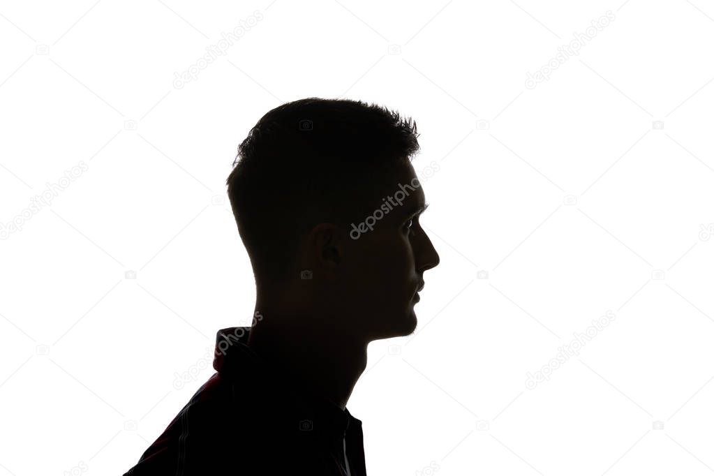 Silhouette of man looking away isolated on white