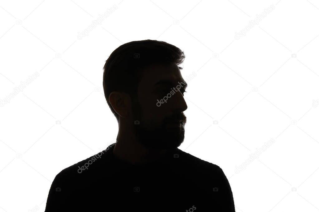 Silhouette of man looking away isolated on white