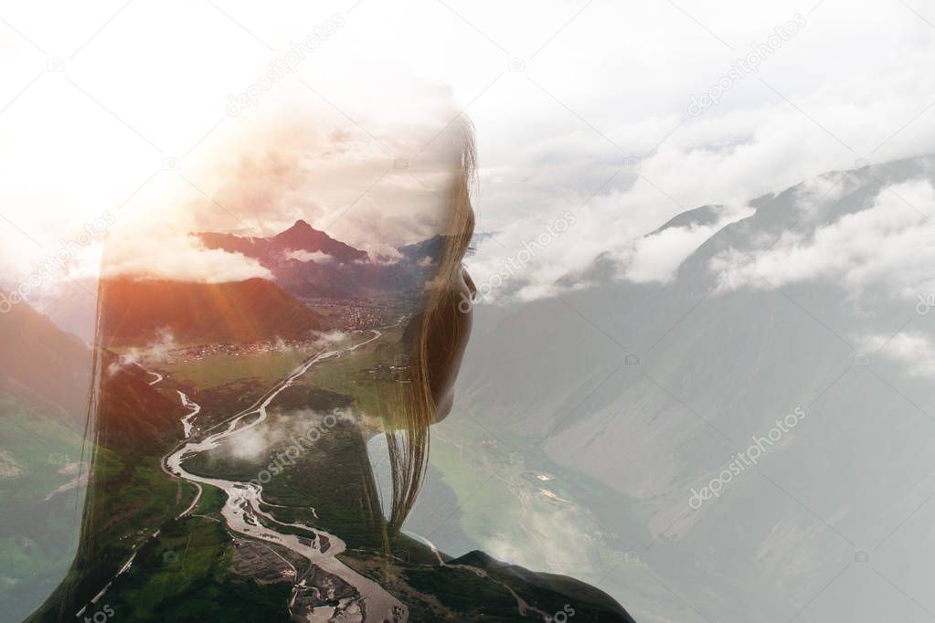 Double exposure of girl and mountains in clouds