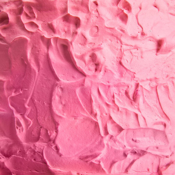 close up of pink cream on tasty baked cake 