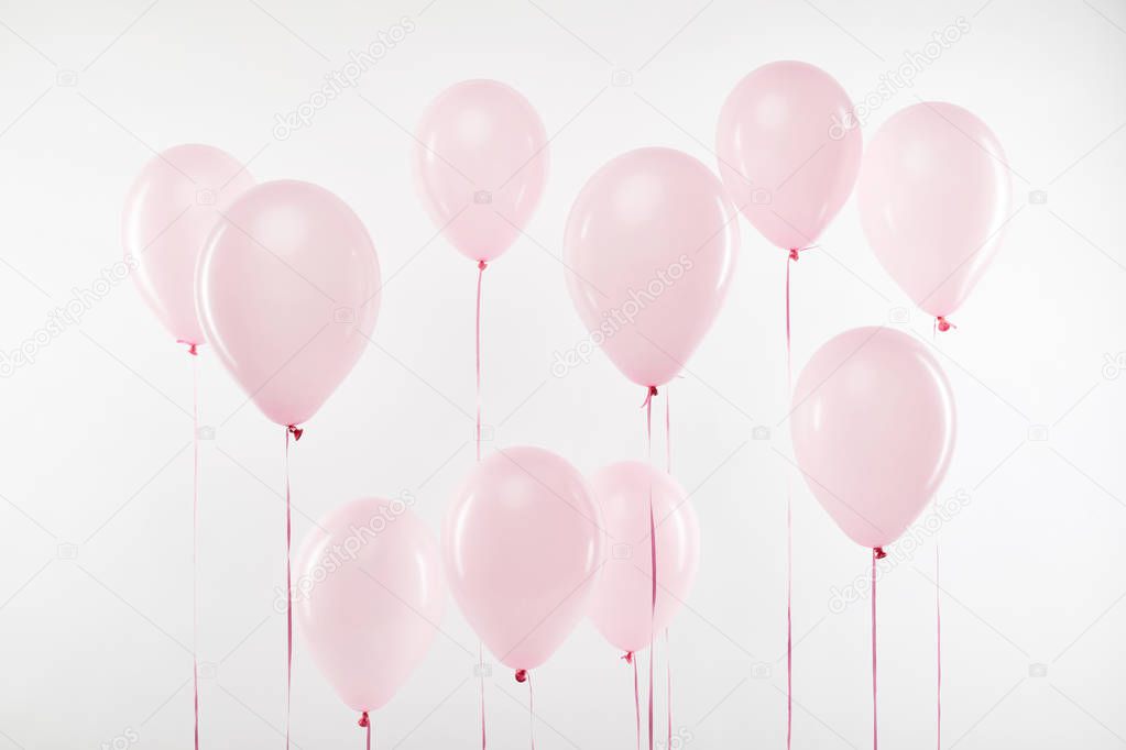 background of decorative pink air balloons isolated on white