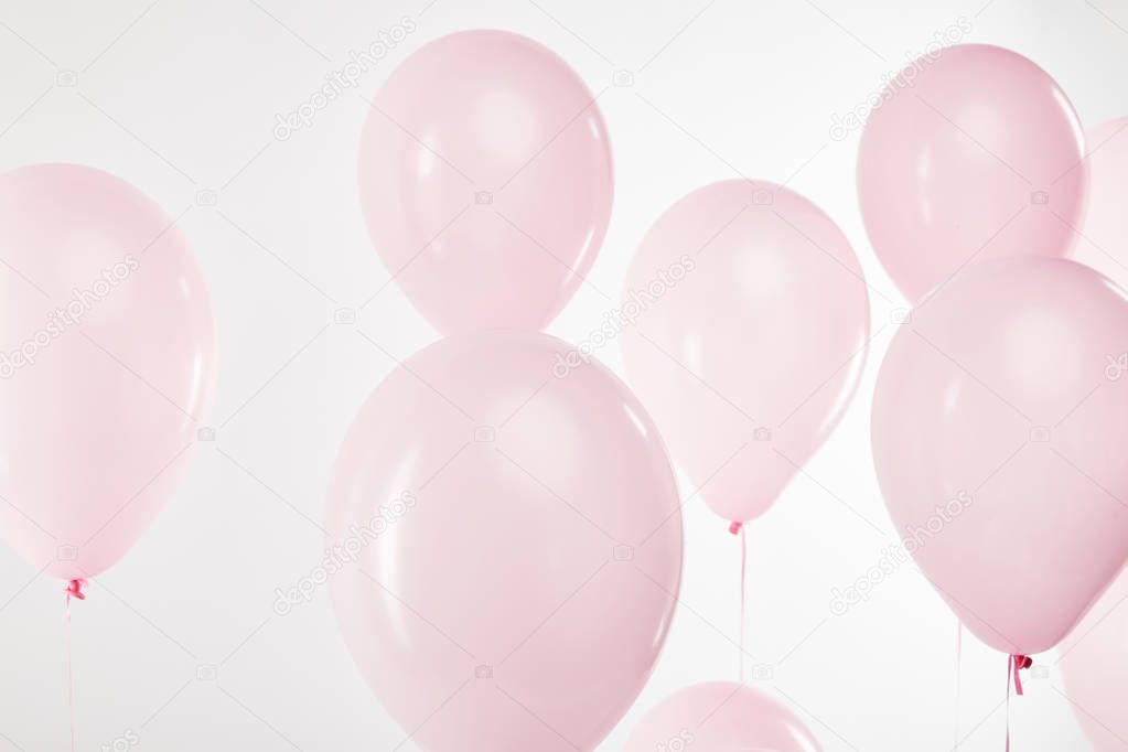 background with decorative floating pink air balloons on white
