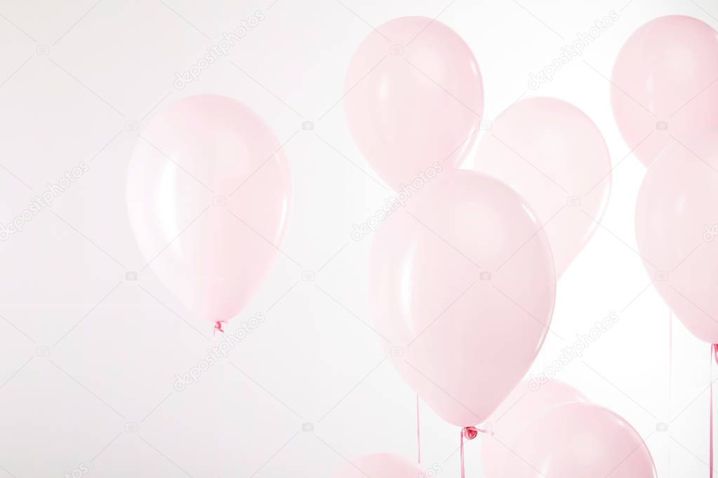 background with decorative pink air balloons on white
