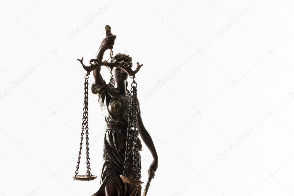 bronze figurine with scales of justice isolated on white