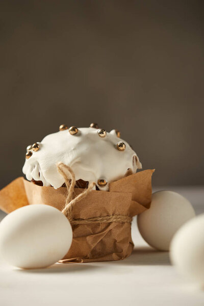 selective focus of delicious easter cake and chicken eggs