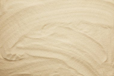 wavy, golden and textured sandy beach in summertime clipart