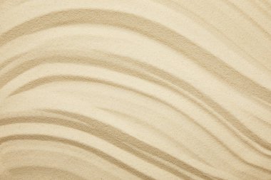 textured and golden sandy surface on beach in summertime clipart