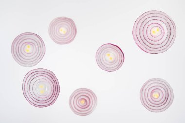 fresh ripe sliced red onions on grey background clipart