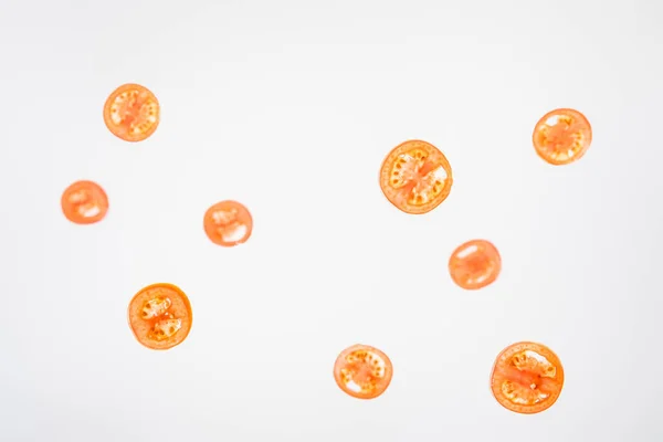 fresh sliced red tomatoes on grey background