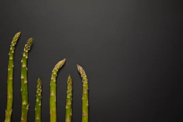 Top View Fresh Green Asparagus Black Surface — Stock Photo, Image