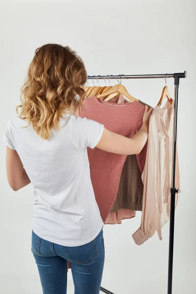 Back View Girl Hanging Hangers Clothes Straight Rack Grey — Stock Photo, Image
