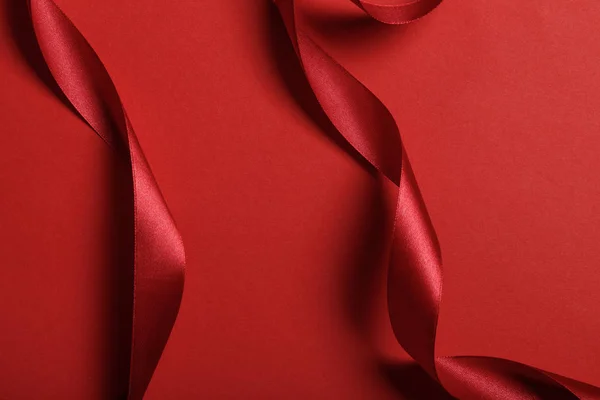 Close Curved Silk Red Ribbons Red Background — Stock Photo, Image