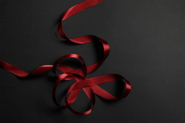Top View Red Satin Wavy Ribbon Black Background Copy Space — Stock Photo, Image