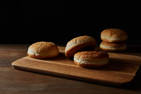 Delicious Buns Sesame Wooden Chopping Board Isolated Black — Stock Photo, Image