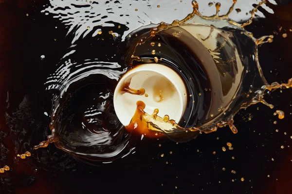 Overturned White Porcelain Cup Black Coffee Splash — Stock Photo, Image