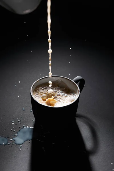 Cup Coffee Pouring Milk Dark Textured Surface — Stock Photo, Image