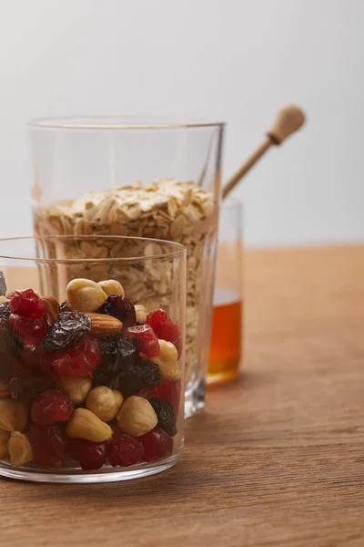 Glasses Dried Berries Nuts Oat Flakes Wooden Table Isolated Grey — Stock Photo, Image