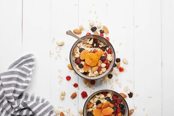 Top View Bowls Muesli Dried Apricots Berries Nuts Served Breakfast — Stock Photo, Image