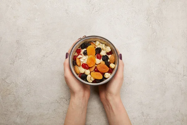 Cropped View Woman Holding Bowl Muesli Dried Apricots Berries Nuts — Stock Photo, Image