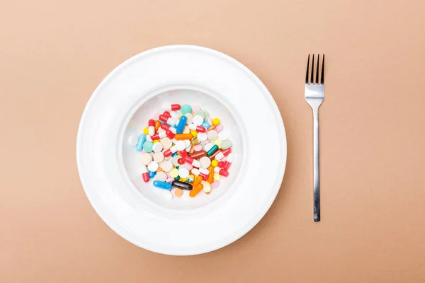 Top View Bowl Pills Fork Brown Surface — Stock Photo, Image