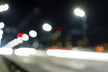 long exposure of bright lights on road at nighttime  clipart