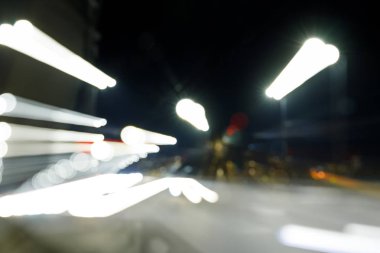 long exposure of bright lights on road at night clipart