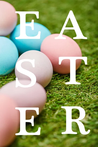 Pile Multicolored Painted Chicken Eggs Easter Lettering Green Grass — Stock Photo, Image