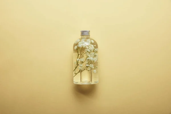 Top View Bottle Organic Beauty Product Dried White Wildflowers Yellow — Stock Photo, Image