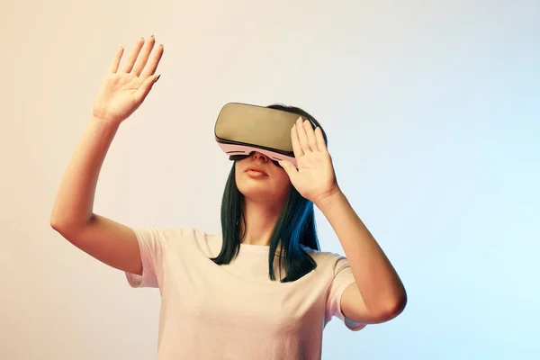 Young Woman Wearing Virtual Reality Headset Gesturing Beige Blue — Stock Photo, Image