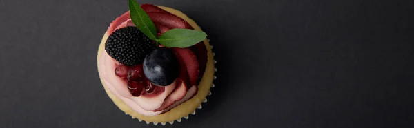 Panoramic Shot Cupcake Cream Garnet Grape Blackberry Black Surface — Stock Photo, Image