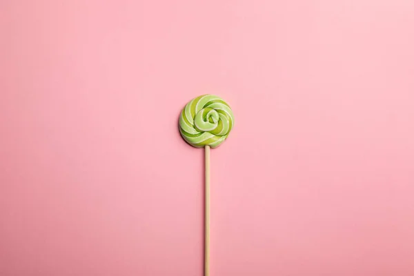 Top View Delicious Green Swirl Lollipop Wooden Stick Pink Background — Stock Photo, Image