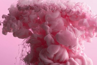 Close up view of pink paint splash in water isolated on pink clipart