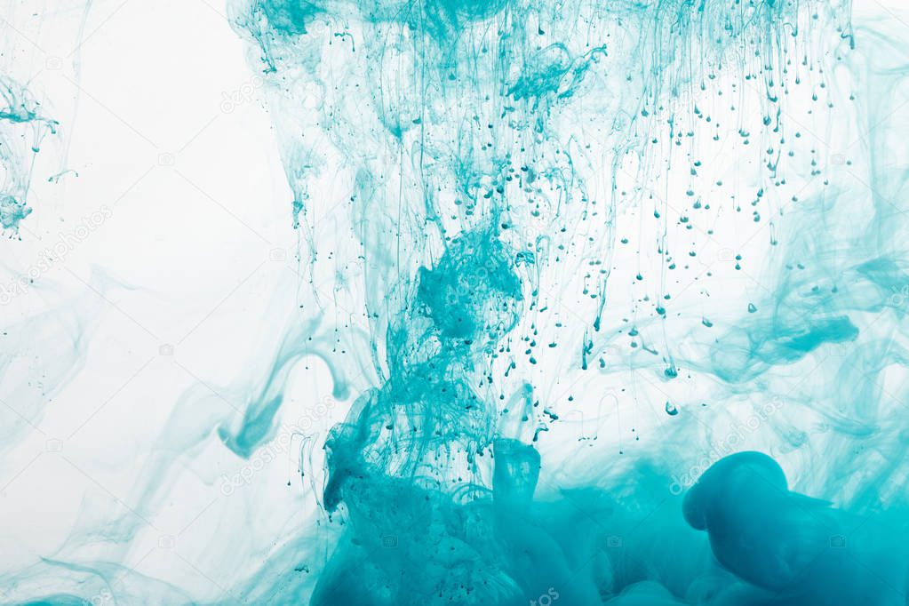 Close up view of blue paint splash in water 
