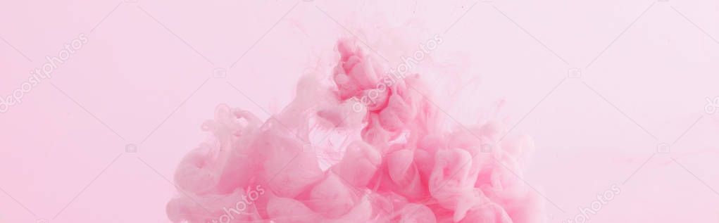 Close up view of pink paint swirls isolated on pink