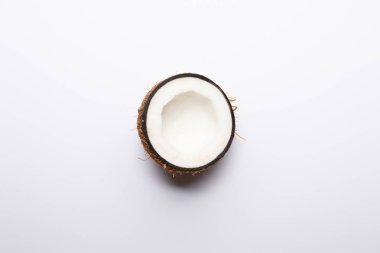 top view of ripe coconut half on white background with copy space clipart