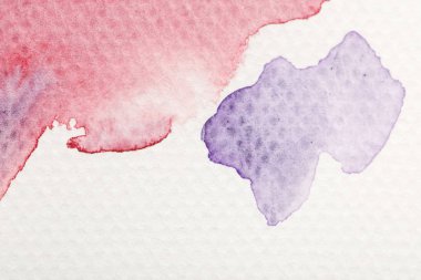 close up view of purple and red watercolor pale paint spills on white background clipart