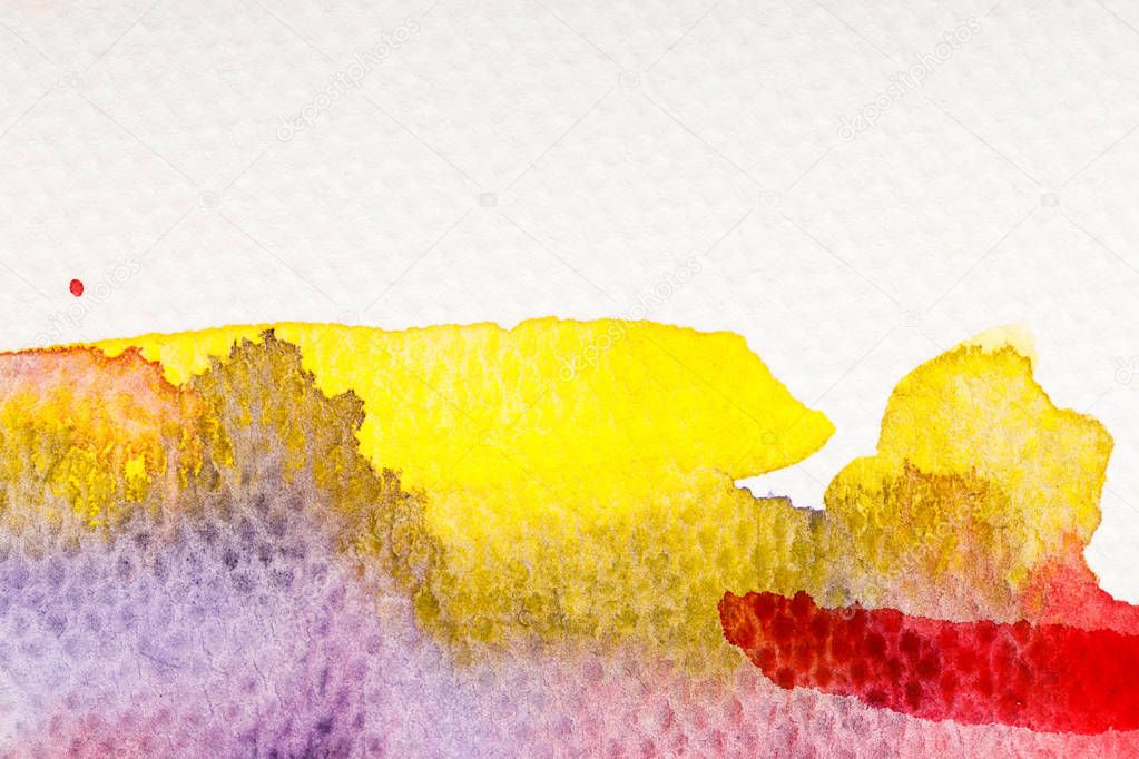 close up view of yellow, purple and red watercolor paint spills on white background with copy space