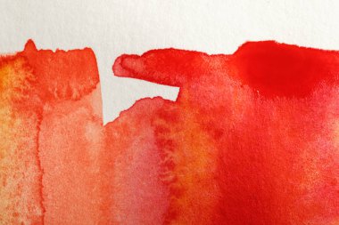 close up view of yellow and red watercolor paints on white background clipart