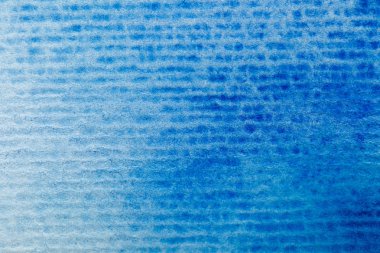 close up view of blue watercolor paint on textured background  clipart