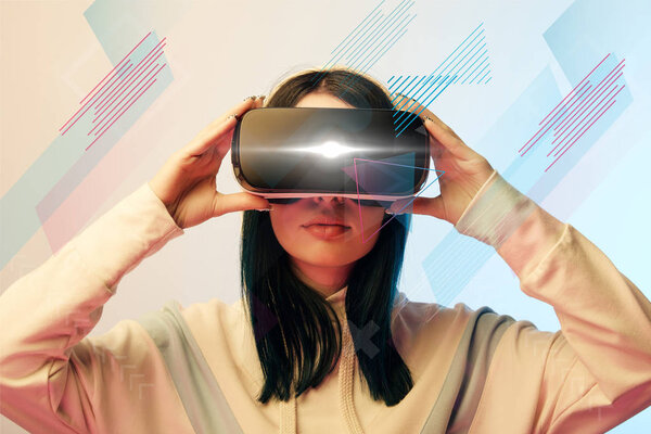 young woman in virtual reality headset with glowing cyber and abstract illustration on beige and blue background