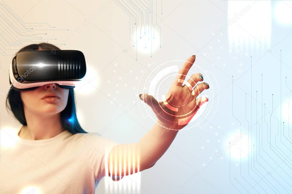 young woman in vr headset holding circle illustration on beige and blue background